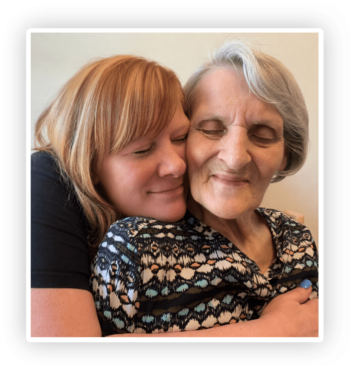 Woman holding her elderly mother